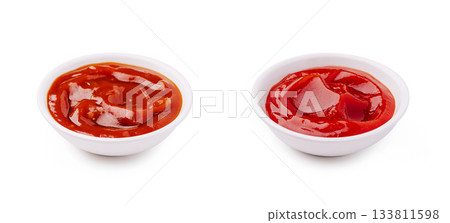 Two bowls of ketchup side by side on a plain background 133811598
