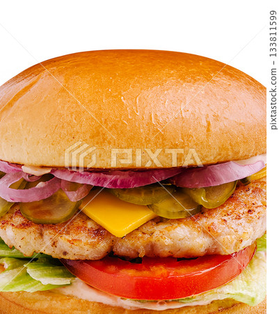 Juicy chicken burger with fresh toppings and a toasted bun Juicy chicken burger with fresh toppings and a toasted bun 133811599