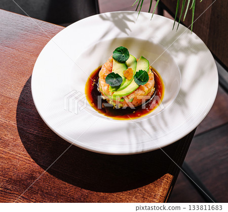 Fresh seafood dish served on a modern restaurant table with natural light 133811683