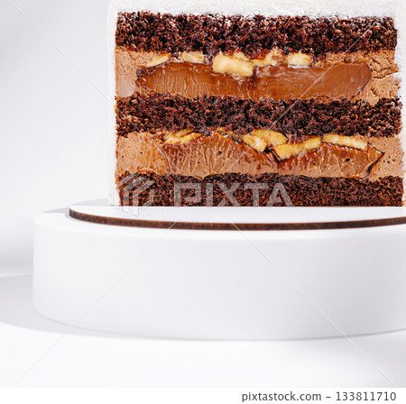 Delicious chocolate cake with layers of cream and caramel filling 133811710