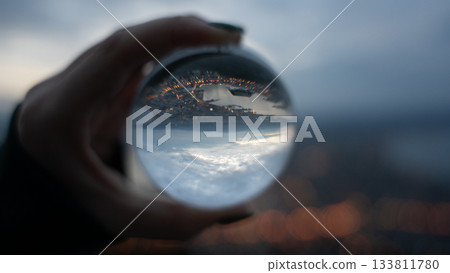 The world reflected in a crystal ball 133811780