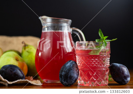 Natural refreshing compote of garden fruits and aromatic herbs 133812603