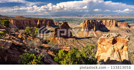 Scenic view of Independence Monument from the Grand View overlook in Colorado National Monument. The Grand Valley and Book Cliffs are visible in the distance Scenic view of Independence Monument from the Grand View overlook in Colorado National Monument. The Grand Valley and Book Cliffs are visible in the distance 133813058