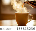 Hot coffee being poured into a 133813236