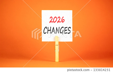 2026 Changes symbol. Concept words 2026 Changes on beautiful white paper on wooden clothespin. Beautiful orange background. Business and 2026 changes concept. Copy space. 2026 Changes symbol. Concept words 2026 Changes on beautiful white paper on wooden clothespin. Beautiful orange background. Business and 2026 changes concept. Copy space. 133814231