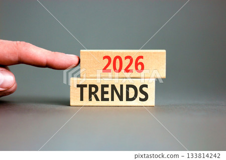 2026 Trends new year symbol. Concept words 2026 Trends on beautiful wooden blocks. Beautiful grey paper background. Businessman's hand. Business and 2026 Trends new year concept. Copy space. 2026 Trends new year symbol. Concept words 2026 Trends on beautiful wooden blocks. Beautiful grey paper background. Businessman's hand. Business and 2026 Trends new year concept. Copy space. 133814242
