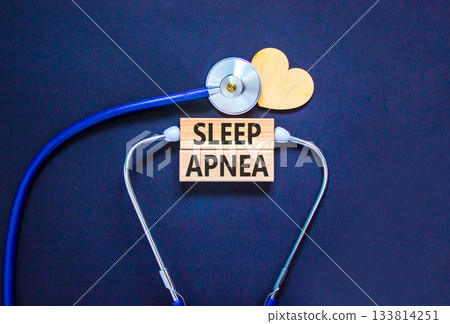Sleep apnea symbol. Concept words Sleep apnea on beautiful wooden blocks. Wooden heart and stethoscope. Beautiful black background. Medical healthy lifestyle sleep apnea concept. Sleep apnea symbol. Concept words Sleep apnea on beautiful wooden blocks. Wooden heart and stethoscope. Beautiful black background. Medical healthy lifestyle sleep apnea concept. 133814251