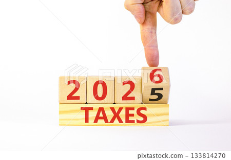 2026 taxes new year symbol. Concept words 2026 taxes on beautiful wooden blocks. Beautiful white paper background. Businessman's hand. Business and 2026 taxes new year concept. Copy space. 2026 taxes new year symbol. Concept words 2026 taxes on beautiful wooden blocks. Beautiful white paper background. Businessman's hand. Business and 2026 taxes new year concept. Copy space. 133814270