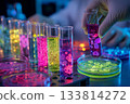 Close-up of the hands of a scientist conducting organic research in a bioluminescent laboratory 133814272