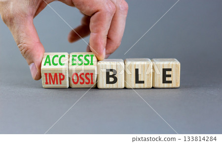 Accessible or impossible symbol. Concept words Accessible or Impossible on beautiful wooden blocks. Beautiful grey table grey background. Business accessible or impossible concept. Copy space. 133814284