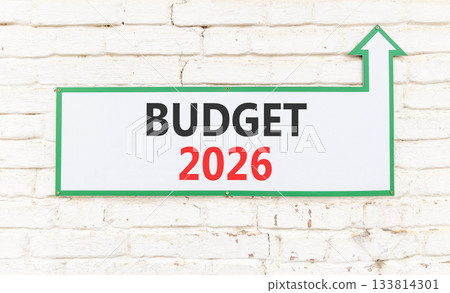Budget 2026 symbol. Concept words Budget 2026 on beautiful white sign with arrow. Beautiful old white brick wall background. Business and budget 2026 concept. Copy space. 133814301