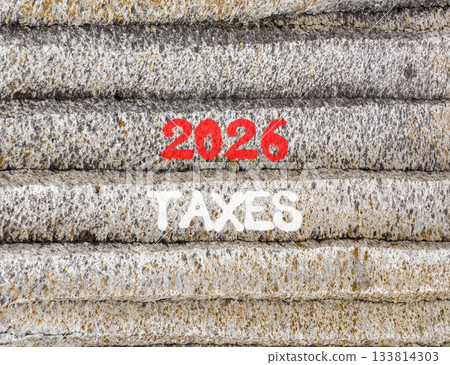 2026 taxes new year symbol. Concept words 2026 taxes on beautiful grey mountain wall. Beautiful grey mountain wall background. Business and 2026 taxes new year concept. Copy space. 2026 taxes new year symbol. Concept words 2026 taxes on beautiful grey mountain wall. Beautiful grey mountain wall background. Business and 2026 taxes new year concept. Copy space. 133814303