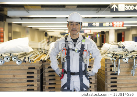 Worker wearing a full harness Worker wearing a full harness 133814556