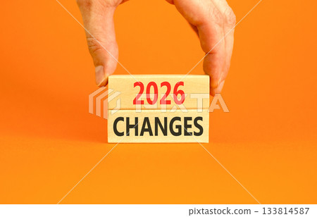 2026 Changes symbol. Concept words 2026 Changes on beautiful wooden blocks. Beautiful orange paper background. Businessman's hand. Business and 2026 changes concept. Copy space. 2026 Changes symbol. Concept words 2026 Changes on beautiful wooden blocks. Beautiful orange paper background. Businessman's hand. Business and 2026 changes concept. Copy space. 133814587