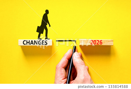 Changes 2026 symbol. Concept words Changes 2026 on beautiful wooden blocks. Beautiful yellow background. Businessman holds pencil. Businessman icon. Business and changes 2026 concept. Copy space. Changes 2026 symbol. Concept words Changes 2026 on beautiful wooden blocks. Beautiful yellow background. Businessman holds pencil. Businessman icon. Business and changes 2026 concept. Copy space. 133814588