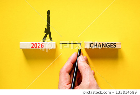 2026 Changes symbol. Concept words 2026 Changes on beautiful wooden blocks. Beautiful yellow background. Businessman holds pencil. Businesswoman icon. Business and 2026 changes concept. Copy space. 2026 Changes symbol. Concept words 2026 Changes on beautiful wooden blocks. Beautiful yellow background. Businessman holds pencil. Businesswoman icon. Business and 2026 changes concept. Copy space. 133814589