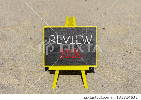 Review 2026 symbol. Concept words Review 2026 on beautiful black blackboard. Beautiful sand beach background. Business and review 2026 concept. Copy space. 133814635
