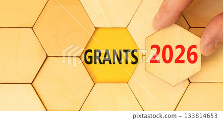 Grants 2026 symbol. Concept words Grants 2026 on beautiful wooden puzzles. Beautiful wooden puzzles background. Businessman's hand. Business and grants 2026 concept. Copy space. Grants 2026 symbol. Concept words Grants 2026 on beautiful wooden puzzles. Beautiful wooden puzzles background. Businessman's hand. Business and grants 2026 concept. Copy space. 133814653
