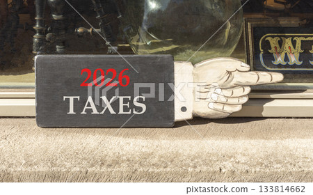 2026 taxes new year symbol. Concept words 2026 taxes on beautiful black wooden hand sign. Beautiful shop display background. Business and 2026 taxes new year concept. Copy space. 2026 taxes new year symbol. Concept words 2026 taxes on beautiful black wooden hand sign. Beautiful shop display background. Business and 2026 taxes new year concept. Copy space. 133814662