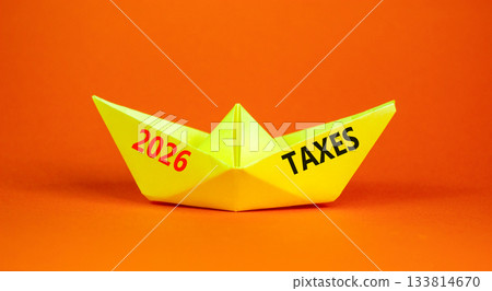 2026 taxes new year symbol. Concept words 2026 taxes on beautiful yellow paper boat. Beautiful orange paper background. Business and 2026 taxes new year concept. Copy space. 133814670
