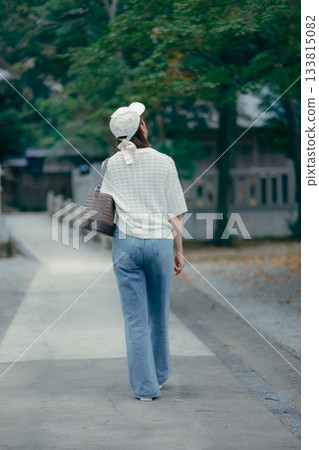 A woman praying at a shrine A woman praying at a shrine 133815082