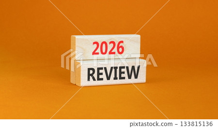 2026 Review symbol. Concept words 2026 Review on beautiful wooden blocks. Beautiful orange paper background. Business and 2026 review concept. Copy space. 133815136