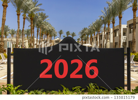 Business concept of 2026 new year symbol. Concept number 2026 Happy new year on beautiful black road sign. Beautiful palm trees palm-tree background. Business 2026 happy new year concept. Copy space. 133815179