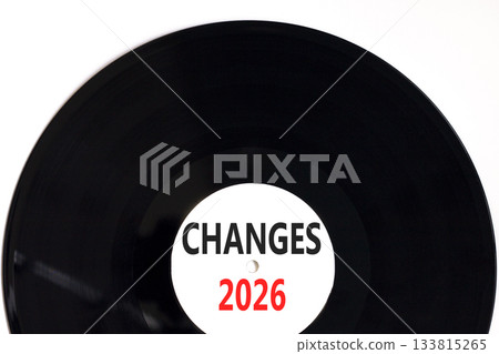 Changes 2026 symbol. Concept words Changes 2026 on beautiful white and black vinyl disk. Beautiful white paper background. Business and changes 2026 concept. Copy space. Changes 2026 symbol. Concept words Changes 2026 on beautiful white and black vinyl disk. Beautiful white paper background. Business and changes 2026 concept. Copy space. 133815265