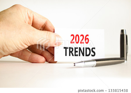 2026 Trends new year symbol. Concept words 2026 Trends on beautiful white card. Beautiful white paper background. Businessman's hand. Business and 2026 Trends new year concept. Copy space. 133815438