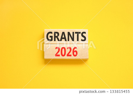 Grants 2026 symbol. Concept words Grants 2026 on beautiful wooden blocks. Beautiful yellow paper background. Business and grants 2026 concept. Copy space. 133815455