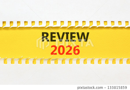 Review 2026 symbol. Concept words Review 2026 on beautiful yellow paper. Beautiful white paper background. Business and review 2026 concept. Copy space. Review 2026 symbol. Concept words Review 2026 on beautiful yellow paper. Beautiful white paper background. Business and review 2026 concept. Copy space. 133815859