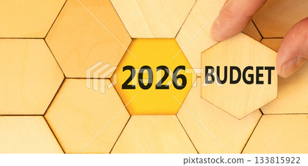 2026 Budget symbol. Concept words 2026 Budget on beautiful wooden puzzles. Beautiful wooden puzzles background. Businessman's hand. Business and 2026 budget concept. Copy space. 2026 Budget symbol. Concept words 2026 Budget on beautiful wooden puzzles. Beautiful wooden puzzles background. Businessman's hand. Business and 2026 budget concept. Copy space. 133815922