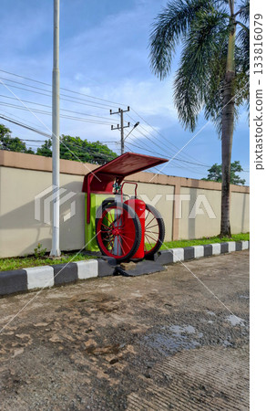 Red Mobile Fire Extinguisher Unit Outdoors Red Mobile Fire Extinguisher Unit Outdoors 133816079