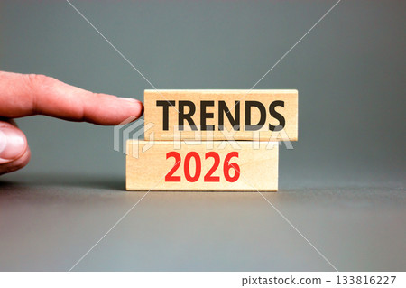 Trends 2026 new year symbol. Concept words Trends 2026 on beautiful wooden blocks. Beautiful grey paper background. Businessman's hand. Business and Trends 2026 new year concept. Copy space. Trends 2026 new year symbol. Concept words Trends 2026 on beautiful wooden blocks. Beautiful grey paper background. Businessman's hand. Business and Trends 2026 new year concept. Copy space. 133816227