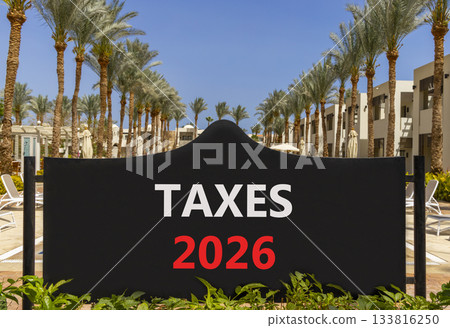 Taxes 2026 new year symbol. Concept words Taxes 2026 on beautiful black road sign. Beautiful palm trees palm-trees and blue sky background. Business and taxes 2026 new year concept. Copy space. Taxes 2026 new year symbol. Concept words Taxes 2026 on beautiful black road sign. Beautiful palm trees palm-trees and blue sky background. Business and taxes 2026 new year concept. Copy space. 133816250