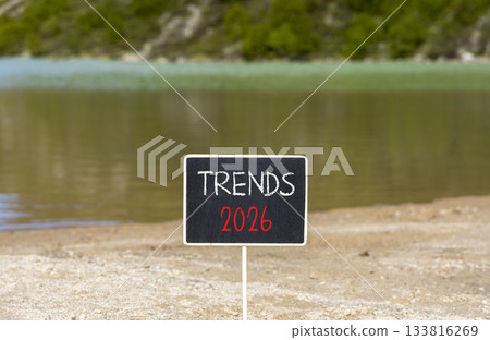 Trends 2026 new year symbol. Concept words Trends 2026 on beautiful black blackboard. Beautiful mountain lake sand beach background. Business and Trends 2026 new year concept. Copy space. 133816269