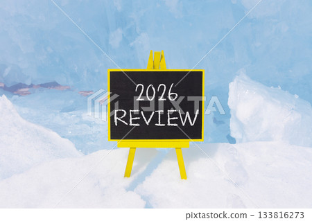 2026 Review symbol. Concept words 2026 Review on beautiful black blackboard. Beautiful blue lake Baikal ice background. Business and 2026 review concept. Copy space. 2026 Review symbol. Concept words 2026 Review on beautiful black blackboard. Beautiful blue lake Baikal ice background. Business and 2026 review concept. Copy space. 133816273