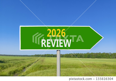 2026 Review symbol. Concept words 2026 Review on beautiful green road sign. Beautiful green grass field forest and blue sky background. Business and 2026 review concept. Copy space. 2026 Review symbol. Concept words 2026 Review on beautiful green road sign. Beautiful green grass field forest and blue sky background. Business and 2026 review concept. Copy space. 133816304