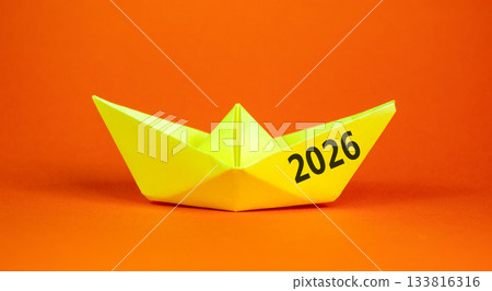 Business concept of 2026 new year symbol. Concept number 2026 Happy new year on beautiful yellow paper boat. Beautiful orange background. Business 2026 happy new year concept. Copy space. Business concept of 2026 new year symbol. Concept number 2026 Happy new year on beautiful yellow paper boat. Beautiful orange background. Business 2026 happy new year concept. Copy space. 133816316
