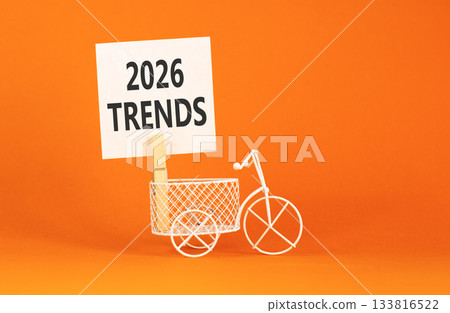 2026 Trends symbol. Concept words 2026 Trends on beautiful white paper on wooden clothespin. Beautiful orange background. Beautiful miniature bicycle. Business 2026 Trends new year concept. Copy space 2026 Trends symbol. Concept words 2026 Trends on beautiful white paper on wooden clothespin. Beautiful orange background. Beautiful miniature bicycle. Business 2026 Trends new year concept. Copy space 133816522