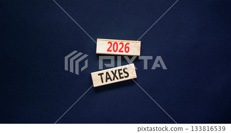 2026 taxes new year symbol. Concept words 2026 taxes on beautiful wooden blocks. Beautiful black paper background. Business and 2026 taxes new year concept. Copy space. 133816539