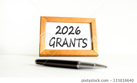 2026 Grants symbol. Concept words 2026 Grants on beautiful wooden picture frame. Beautiful white paper background. Beautiful black pen. Business and 2026 grants concept. Copy space. 2026 Grants symbol. Concept words 2026 Grants on beautiful wooden picture frame. Beautiful white paper background. Beautiful black pen. Business and 2026 grants concept. Copy space. 133816640