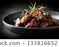 beef rendang with glossy rich sauce on black background 133816652