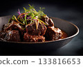 beef rendang with glossy rich sauce on black background 133816653
