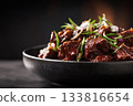 beef rendang with glossy rich sauce on black background 133816654