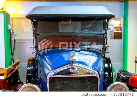 Classic vintage car on display in museum, showcasing its intricate design historical significance 133816771