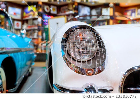 Classic car headlight with metal grille vintage decor at car museum Classic car headlight with metal grille vintage decor at car museum 133816772
