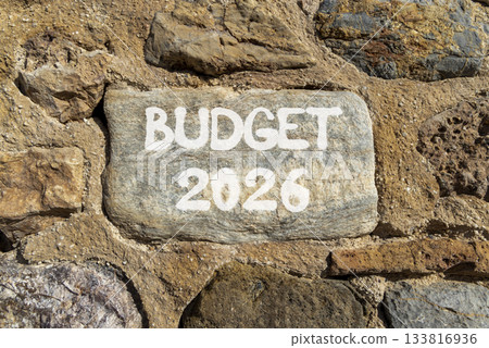 Budget 2026 symbol. Concept words Budget 2026 on beautiful grey stone on stone wall. Beautiful stone wall background. Business and budget 2026 concept. Copy space. Budget 2026 symbol. Concept words Budget 2026 on beautiful grey stone on stone wall. Beautiful stone wall background. Business and budget 2026 concept. Copy space. 133816936