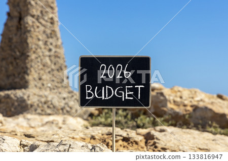 2026 Budget symbol. Concept words 2026 Budget on beautiful black blackboard. Beautiful stone and blue sky background. Business and 2026 budget concept. Copy space. 133816947