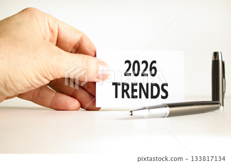2026 Trends new year symbol. Concept words 2026 Trends on beautiful white card. Beautiful white paper background. Businessman's hand. Business and 2026 Trends new year concept. Copy space. 133817134